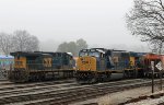 CSX 489, 4528 & 7025 sit in the yard on a foggy morning